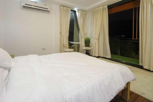 Katil atau katil-katil dalam bilik di Green Meadows Farmhouse