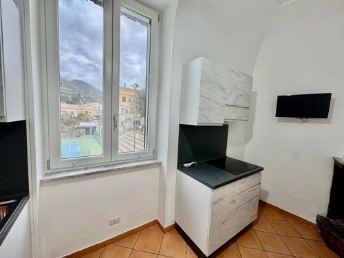 Η κουζίνα ή μικρή κουζίνα στο La Casa di Nina