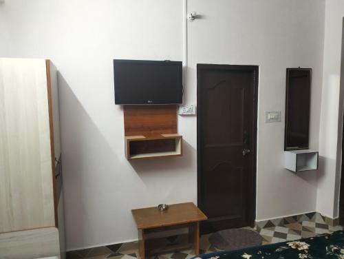 TV a/nebo společenská místnost v ubytování Aman Inn