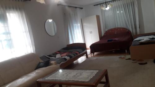 a living room with a couch and a coffee table at Apartman Struga in Struga