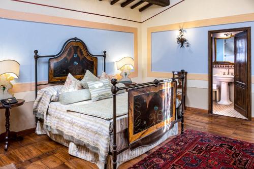 a bedroom with a large bed in a room at Locanda Del Molino in Cortona