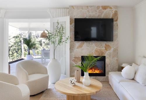 a living room with a fireplace and a tv at Be quick - Xmas holidays luxury for 12 people! in Montville