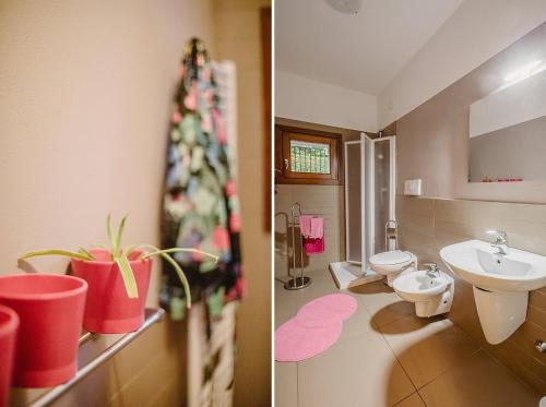 a bathroom with a toilet and a sink at PELACA' Resort in Gargnano