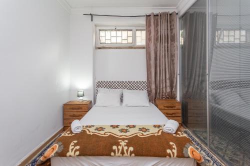 a bedroom with a bed and a window at Lisbon Apartment 3 in Lisbon