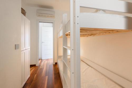 a bedroom with a bunk bed in a room at Golden Luxe - Panoramic Penthouse Rooftop whit Pool in Lido di Camaiore