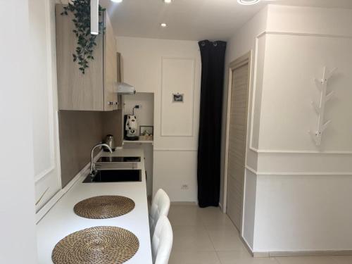 a kitchen with white walls and a white counter top at casa effe 2 in Naples