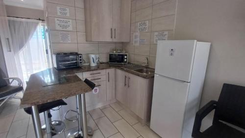 Kuchyň nebo kuchyňský kout v ubytování Ceelee's Place