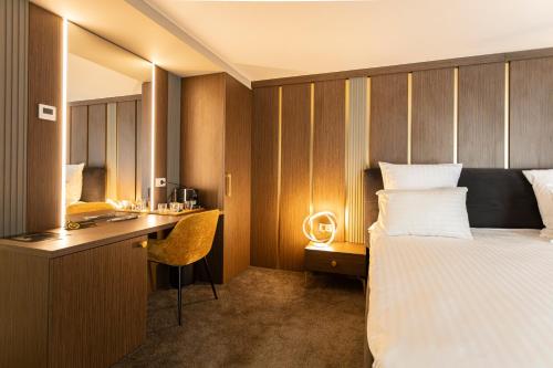 Postel nebo postele na pokoji v ubytování Ganzo Boutique Hotel