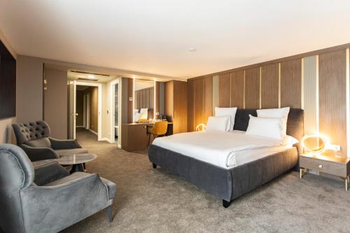 Postel nebo postele na pokoji v ubytování Ganzo Boutique Hotel