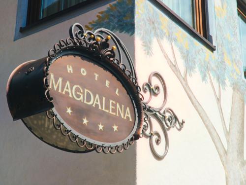 a sign on the side of a building at Hotel Magdalena Mayrhofen in Mayrhofen