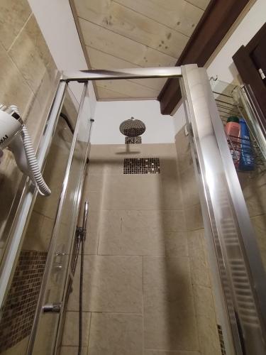 a shower with a glass door in a bathroom at Antico Centro Quartu in Quartu SantʼElena