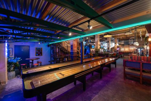 a row of benches in a bar with tables and chairs at The Market House in Reading