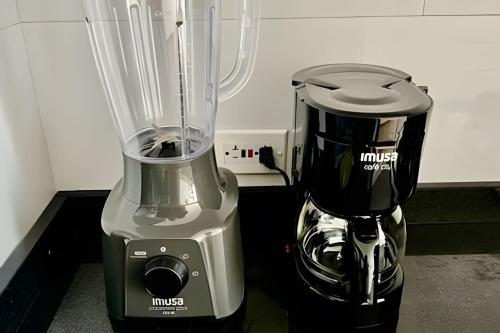 a blender sitting on the floor next to a counter at Edificio Urban in Cajicá