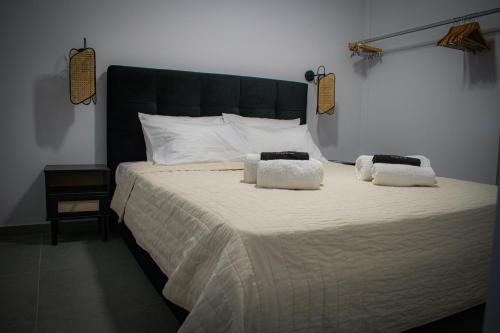 a bedroom with a large bed with two pillows on it at Nomad apartment in Chóra