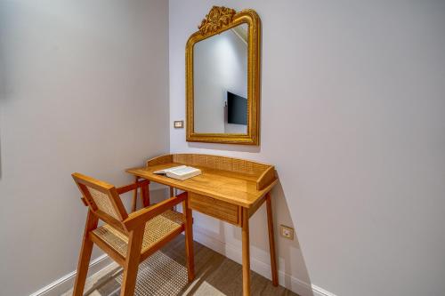 a dressing table with a mirror and a chair at Hotel Brattia, Adults Only, Heated Pool, A la Carte Breakfast, Postira, Brač Island in Postira