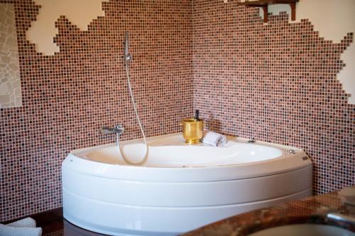 a bathroom with a toilet and a sink in it at Villa Anna in Genzano di Roma