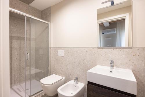 a bathroom with a sink and a toilet and a shower at Luxury Home in Vicenza in Vicenza