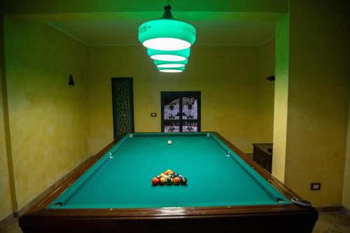a pool table with balls on it in a room at Villa Anna in Genzano di Roma