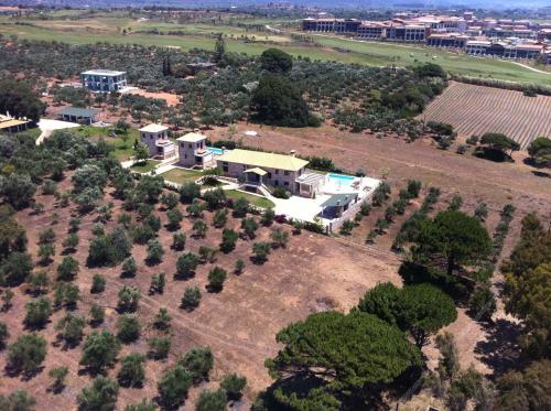 an aerial view of a large house with trees at Yialenia Estate in Rikia