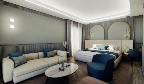 a hotel room with a bed and a couch at Grand Hotel Bristol in Stresa
