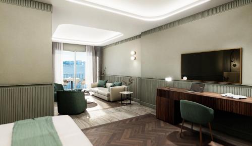 a hotel room with a bed and a flat screen tv at Grand Hotel Bristol in Stresa