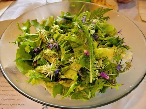 a salad on a plate on a table at Chalet d'Arvière in Lochieu