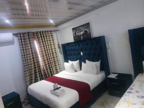 a hotel room with a bed and a window at Gold Crown International Hotel With Complementary Breakfast and WiFi in Johannesburg