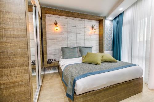 a bedroom with a bed and a shower at Elite World Nest Sivas in Sivas