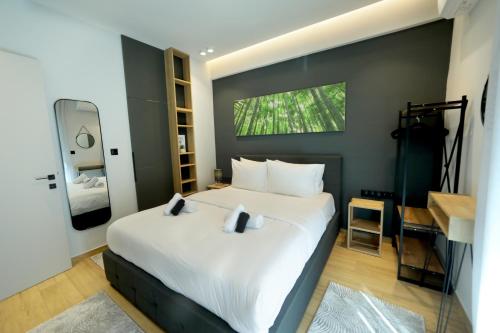 a bedroom with a large white bed and a window at Lago Suite in Kastoria
