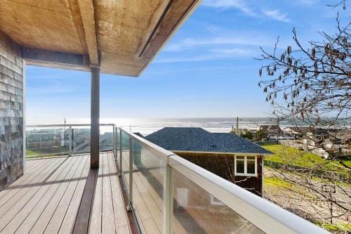 a balcony with a view of the ocean at SeaLah in Lincoln City
