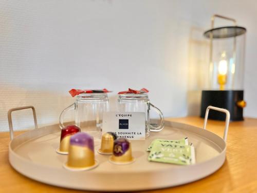 a plate with some food on a table at Le Terrazzo - Élégant - Centre - Balcon - Lumineux in Mont-de-Marsan