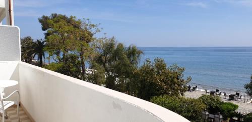 a balcony with a view of the beach at Grand Hotel Mediterranee in Alassio