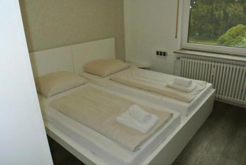 Ένα ή περισσότερα κρεβάτια σε δωμάτιο στο Kemnater Hof Apartments