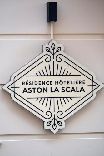 a sign for aisson hotelsta station la scala at Résidence Aston la Scala in Nice