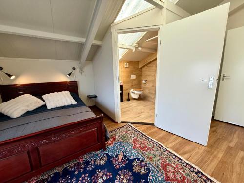 Ένα ή περισσότερα κρεβάτια σε δωμάτιο στο Holiday Home Vijfhuizen