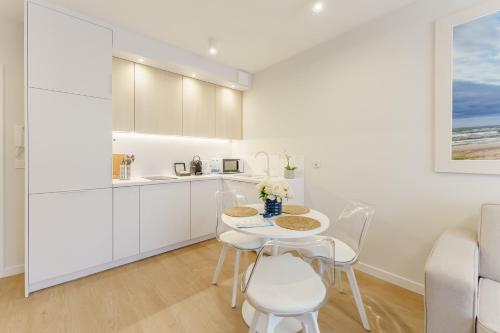 Kuchyň nebo kuchyňský kout v ubytování Apartament Młyńska 10