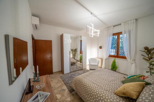 a bedroom with a bed and a mirror at Da Luigi Pio in Florence
