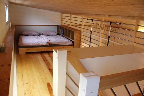 Ένα ή περισσότερα κρεβάτια σε δωμάτιο στο Sunny Loft mit wunderschöner Terrasse