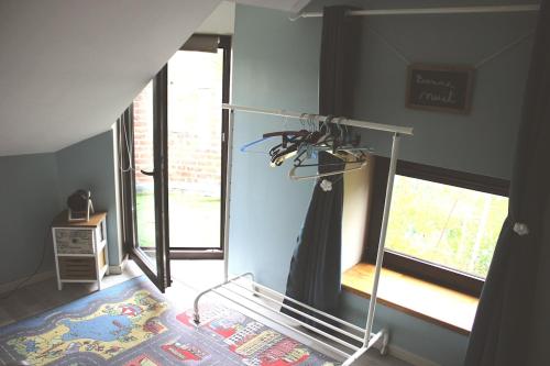 a treadmill in a room with a window at Gite 1815 avec sauna privatif in Braine-lʼAlleud