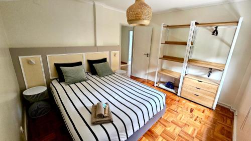 Ένα ή περισσότερα κρεβάτια σε δωμάτιο στο Riverside Nature Apartment