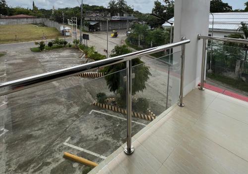 a balcony with a view of a parking lot at Mgf Franz Pension House in Bogo