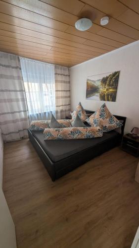 a bedroom with a large bed with pillows on it at Via Roma 257 Apartament in Cochem