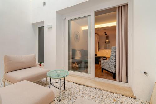 a living room with a couch and a table at La casa de la Abuela in Marbella