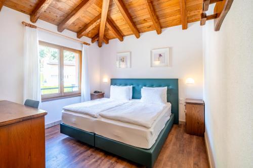 Postel nebo postele na pokoji v ubytování Hotel Il Castagno