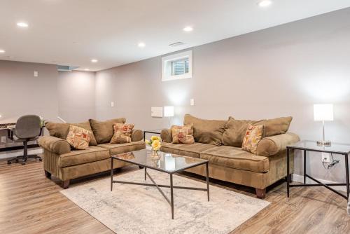 a living room with a couch and a table at Cottonwood Loveland in Loveland