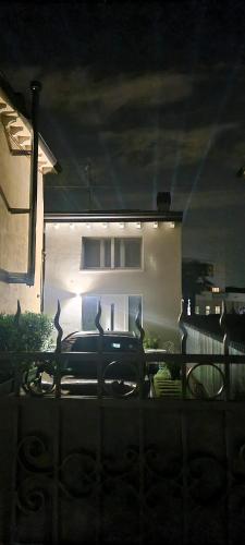 a car parked in front of a house at night at Villa Joy Verona - Chalet Delux in Verona