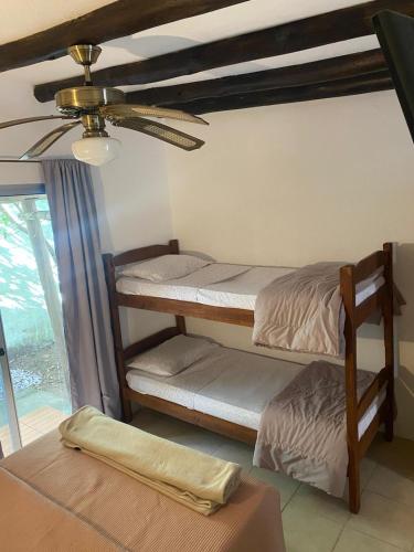 Postel nebo postele na pokoji v ubytování Complejo Heliópolis