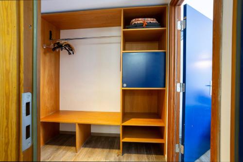 a room with a closet with a tv in it at Hotel Seebrücke in Lubmin