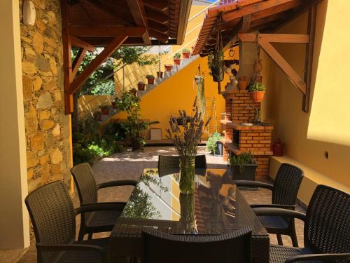 a patio with a table and chairs and stairs at Casa Cova do Barro in Janeiro de Cima
