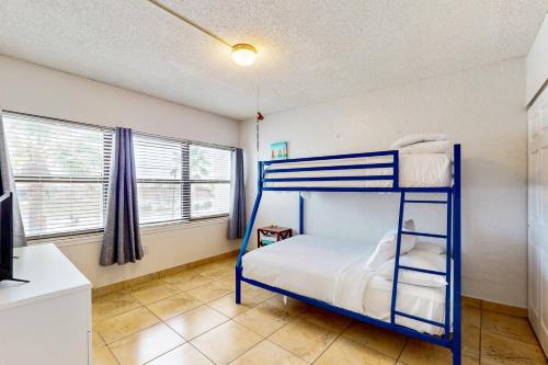 a bedroom with a bunk bed in a room at Fairways #204 in Padre Island
